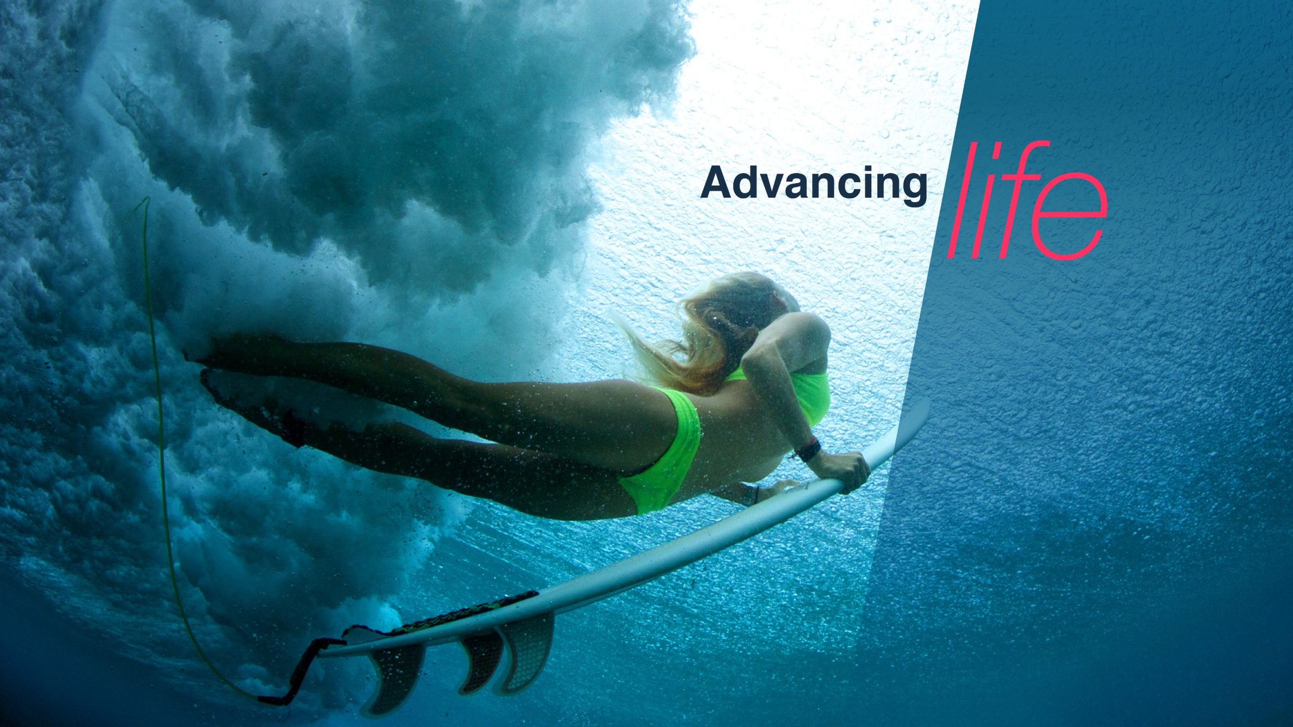 Advancing life: a surfer diving under a wave
