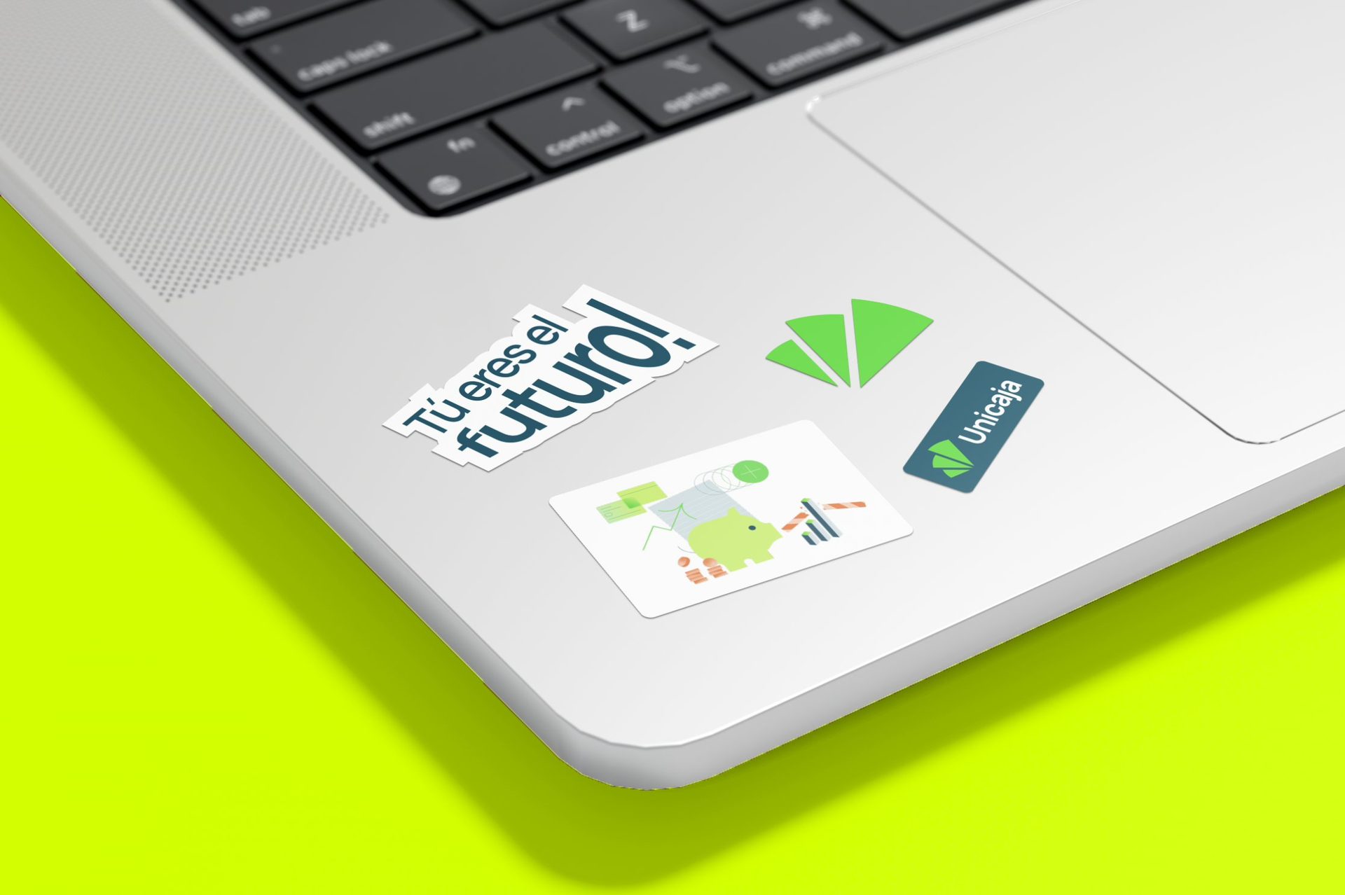 Unicaja stickers on a laptop: Tú eres el futuro